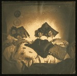 Etta Atwell and friends in bed