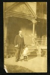 President Henry Whitfield and son at his home by Lottie Street