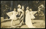 Students in pageant costumes
